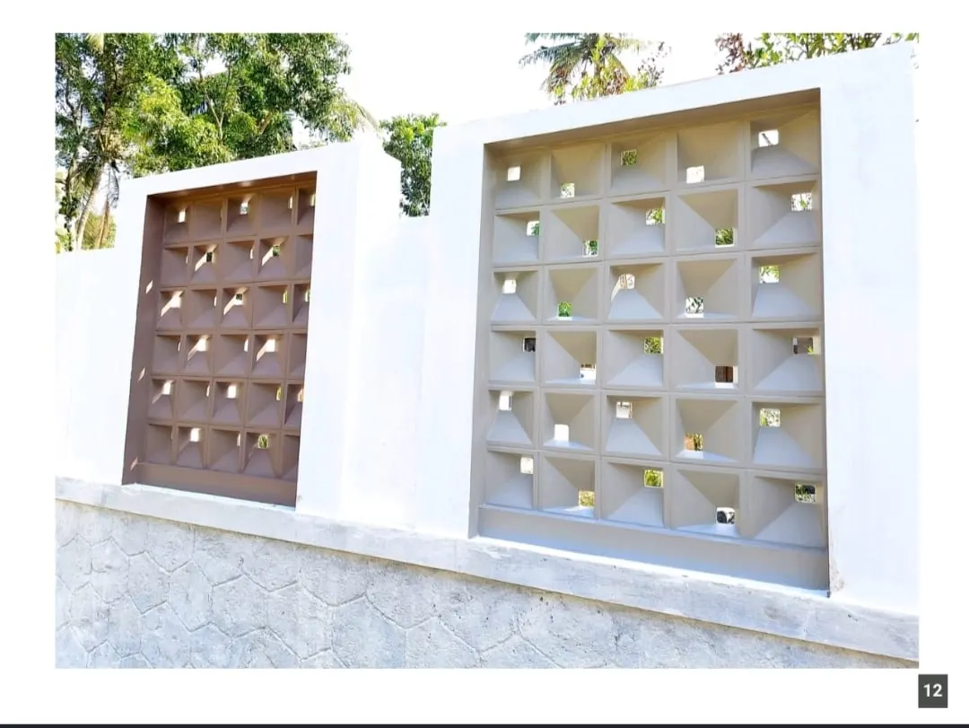 Camera pattern jali blocks installed as a building facade screen