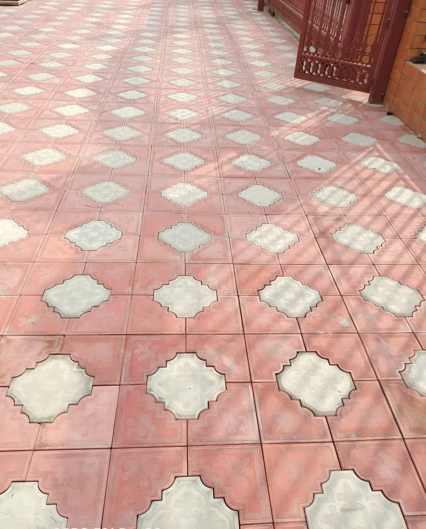 Red and grey tile pattern on a car parking approach