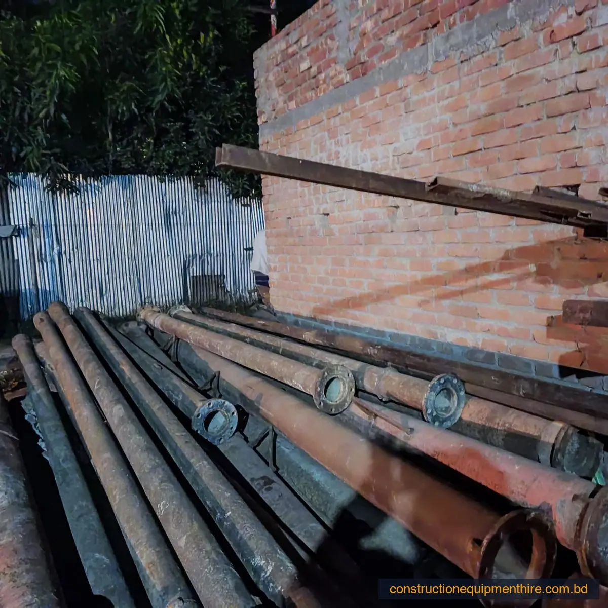 Drill rods stacked at the yard