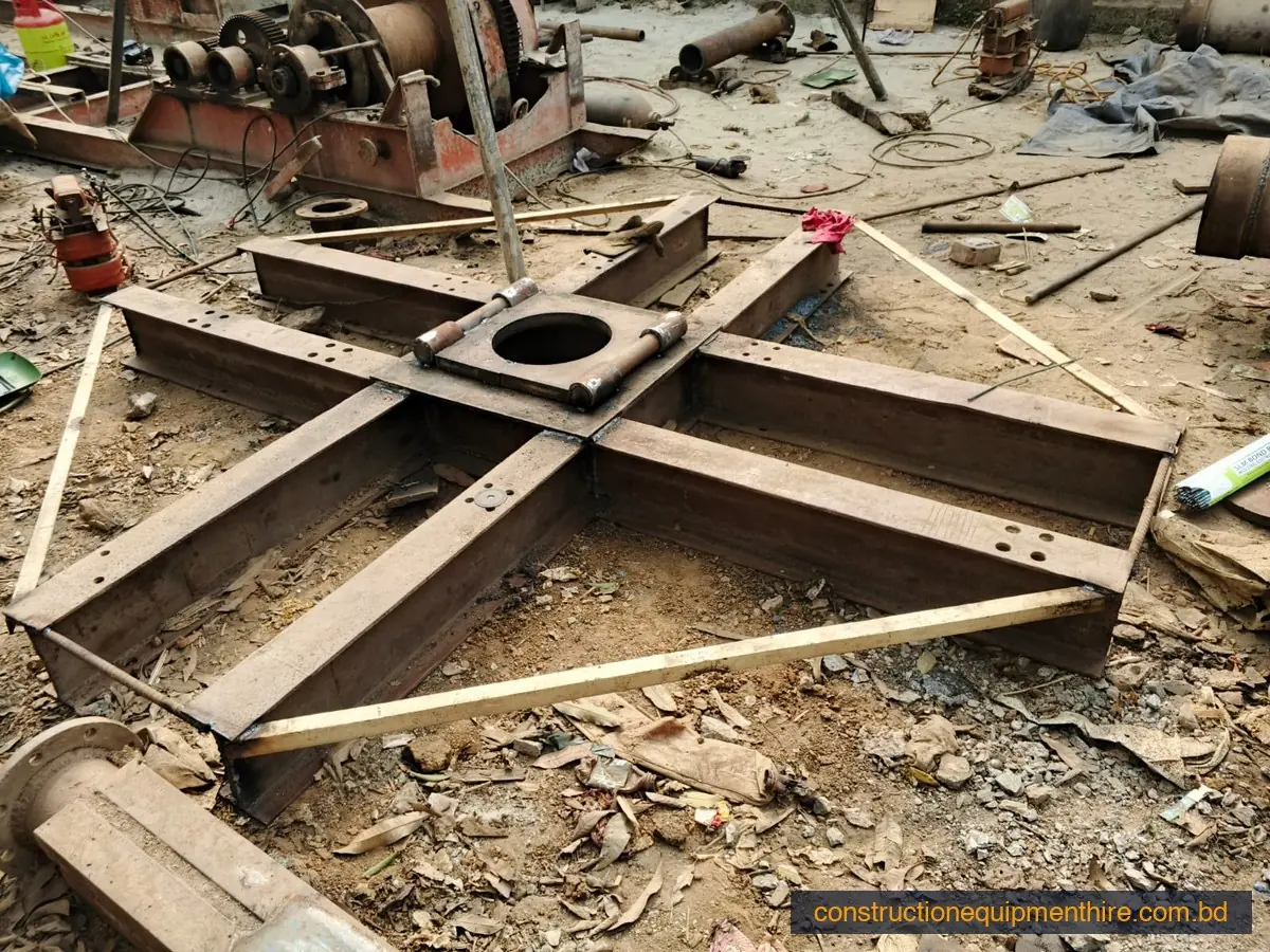 Rig base frame set over a pile point